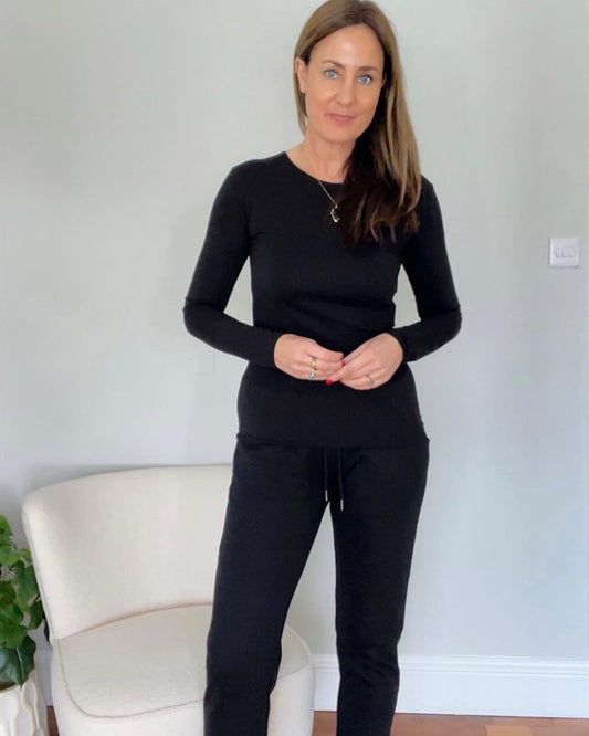 Tall woman wearing slim fit black joggers