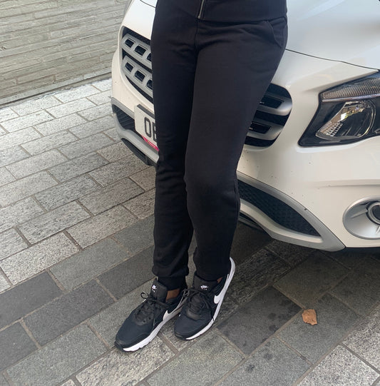 Model wearing high-waisted black tall joggers for women