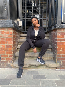 Tall women’s black joggers outfit styled for casual streetwear