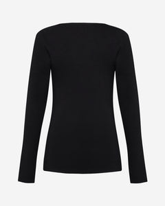 Back of tall woman long sleeve black top