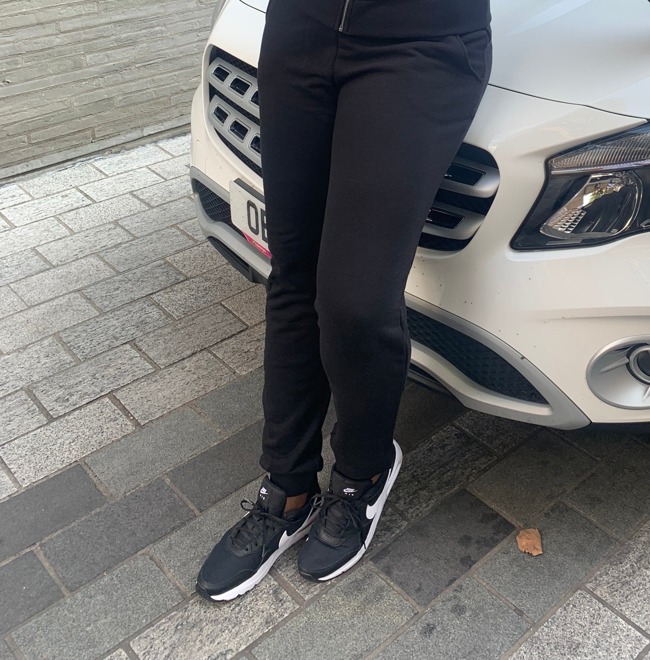Front view of tall women's black joggers with high waist and long inseam